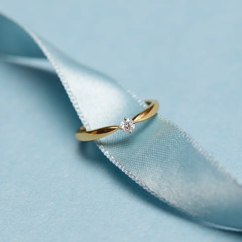 Gleaming Round Solitaire Ring