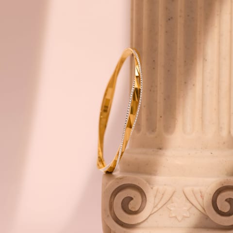 Subtle Twist Gold Bangle